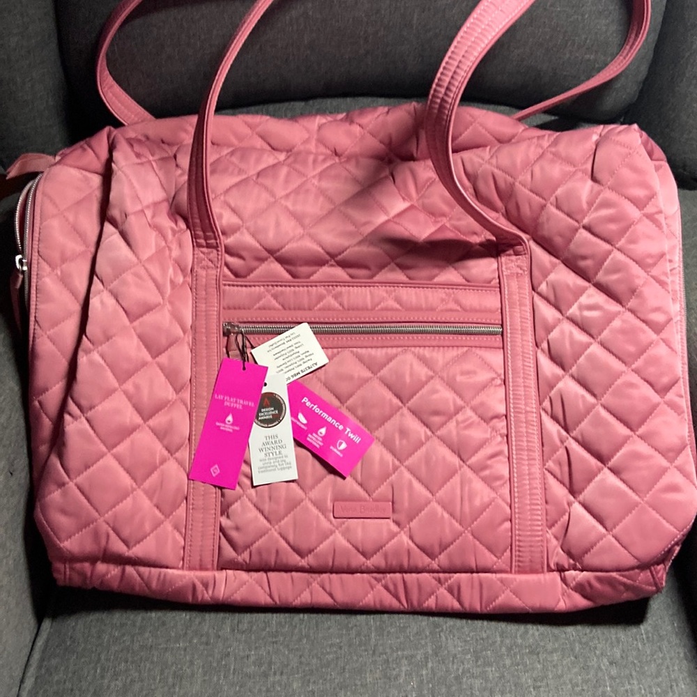 Vera Bradley Performance Twill Lay-Flat Duffel in pink.